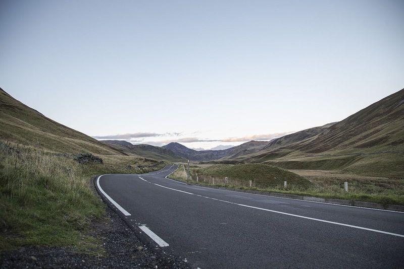 An empty road running through Cairngorms National Park