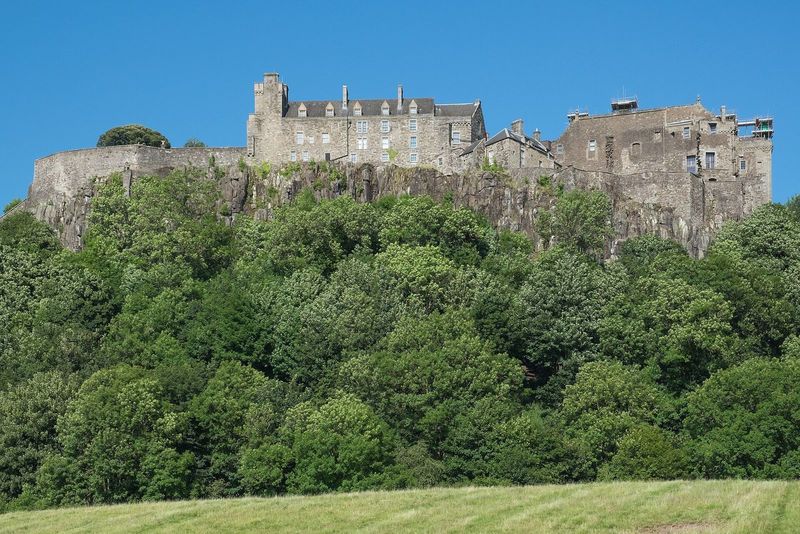 Stirling Castle on its volcanic crag above the trees